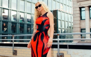 Iggy Azalea Seductively Poses in Viral MSCHF's Big Red Boots and Bright Red Thong