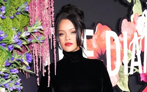 Rihanna Fuels Pregnancy Rumor After Being Caught on Camera Fake-Sipping Champagne 