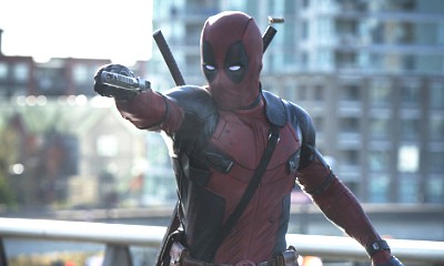 Deadpool Is Dangling in Front of a Billboard in New Set Photos of Sequel