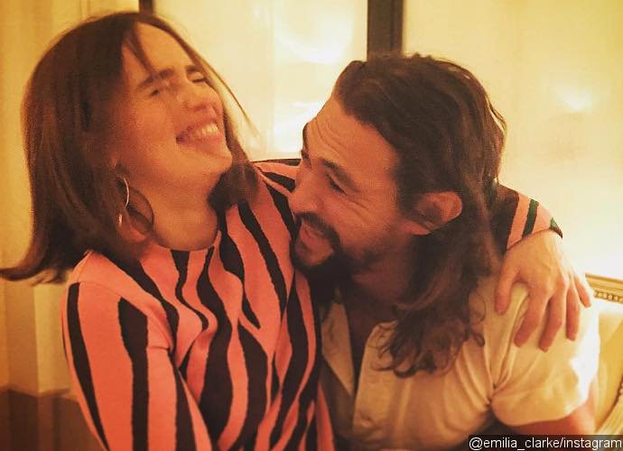 Emilia Clarke Cuddles Jason Momoa as They Reunite During Paris Fashion Week