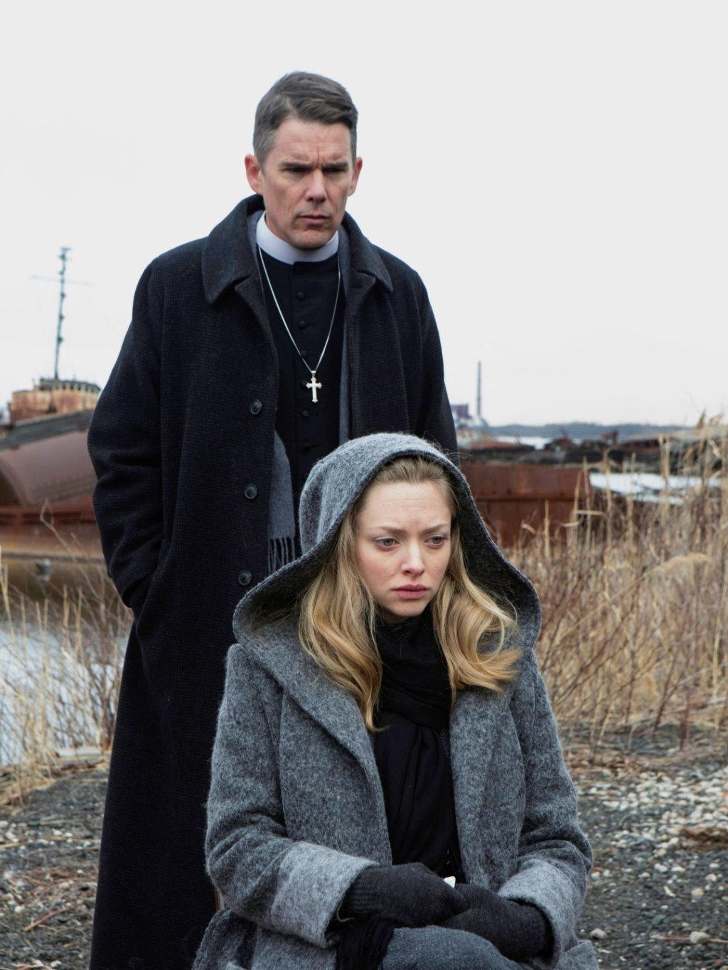 Ethan Hawke stars as Toller and Amanda Seyfried stars as Mary in A24's First Reformed (2018)