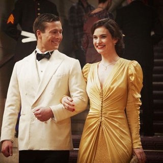 Glen Powell stars as Mark Reynolds and Lily James stars as Juliet Ashton in Netflix's The Guernsey Literary and Potato Peel Pie Society (2018)