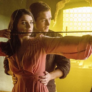 Eve Hewson stars as Maid Marian and Taron Egerton stars as Robin Hood in Lionsgate Films' Robin Hood (2018)