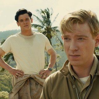 Jack O'Connell stars as Louis Zamperini and Domhnall Gleeson stars as Russell Allen 'Phil' Phillips in Universal Pictures' Unbroken (2014)
