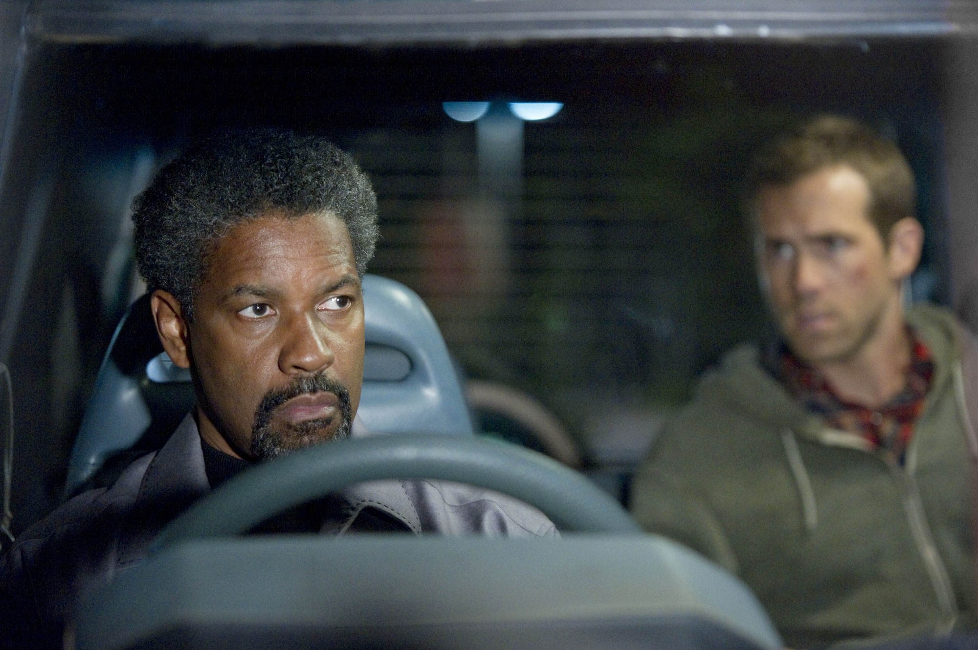 Denzel Washington stars as Tobin Frost and Ryan Reynolds stars as Matt Weston in 	Universal Pictures' Safe House (2012)