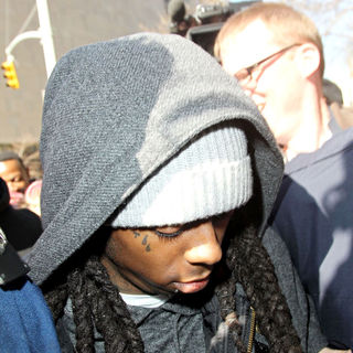 Lil Wayne arrives at Manhattan Criminal Court to begin his sentence for weapons possession charges