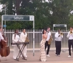 RAYE Offers Spectacular Performance of 'Genesis' on Train Station Platform