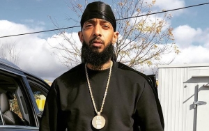 Nipsey Hussle Caught on Camera Throwing Punches in Parking Lot Brawl