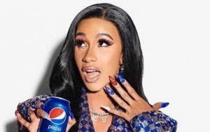 Watch: Cardi B Gives Christmas Carol Her Own Fun Twist in New Pepsi Commercial