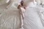 Kanye West Flaunts Wife Bianca Censori's Curves in 'Scary' Video of Her on Massive Bed