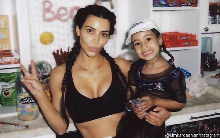 Kim Kardashian Criticized for Straightening North West's Curly Hair