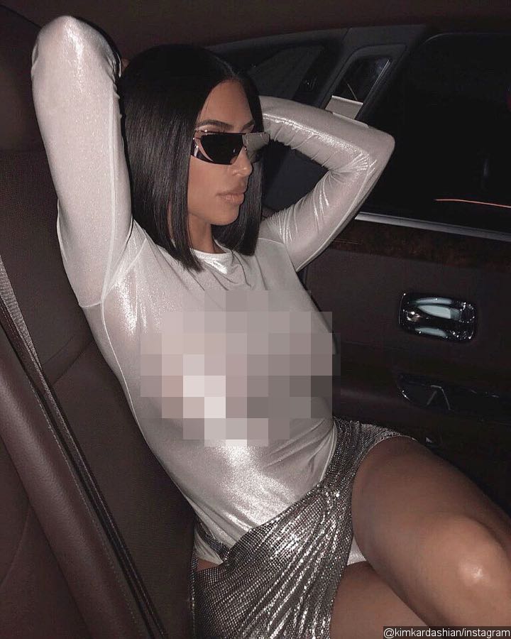 Kim Kardashian accidentally flashes her crotch in a shimmery Versace skirt