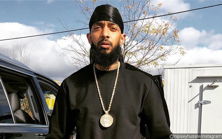 Nipsey Hussle Caught on Camera Throwing Punches in Parking Lot Brawl