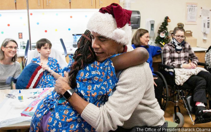 Barack Obama Plays Santa Claus on Surprise Visit to Children's Hospital