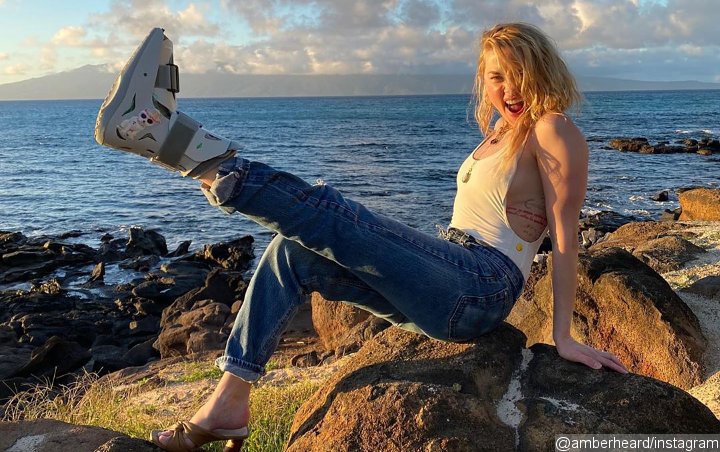 Amber Heard Pokes Fun at Ankle Injury in Hawaii Vacation Posts