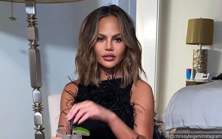 Chrissy Teigen Offers to Help Fan Find Tattoo for Stillborn Son Tribute After Showing Off Her Own