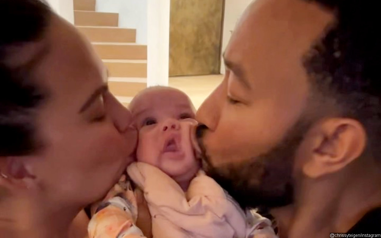 Chrissy Teigen and John Legend Give Baby Esti Her 'First Kiss' in Cute Video