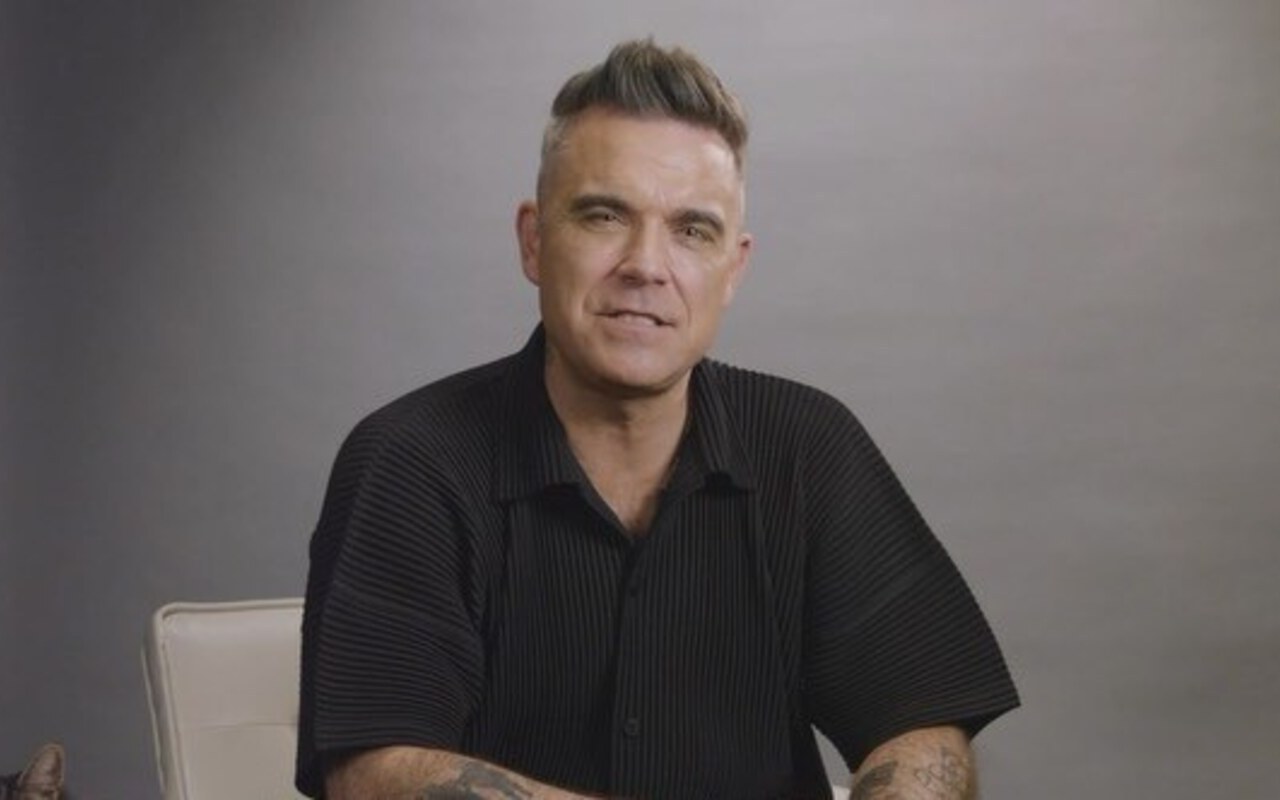 Robbie Williams Facing Potential Trademark Dispute Amid Plans to Launch Business Empire