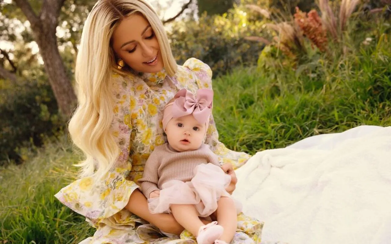 Paris Hilton Flashes Huge Smile in First Pictures With Baby Daughter London