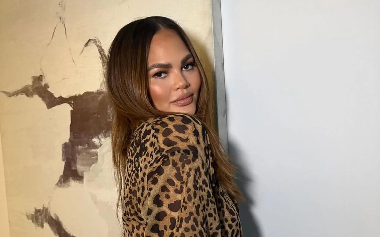 Chrissy Teigen Shares Pic of Neck Brace, Jokes About Her Absence From Met Gala 2024
