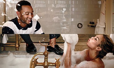 Chrissy Teigen Flashes Nipple in Bathtub as John Legend Enjoys Champagne Near Her