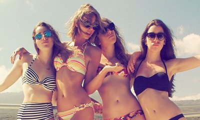 Taylor Swift Shows Belly Button in Bikini Picture, Diplo Calls Her Fans 'Evil Human Beings'