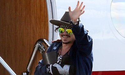 Injured Johnny Depp Sports Taped Up Hand When Leaving Australia