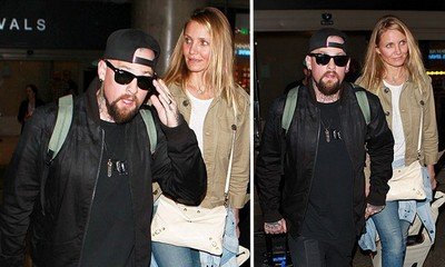 Cameron Diaz Sparks Pregnancy Rumors as She Appears to Cover Her Stomach at LAX