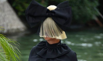 Sia Conceals Her Face With Trademark Blonde Wig and Huge Bow at Venice Film Festival