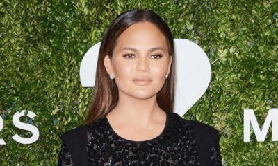 Chrissy Teigen Bares Cleavage in Sexy Swimsuit to Cook for Her Birthday