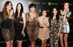 Kim Kardashian Divides OPI Paycheck Equally to Mom and Sisters