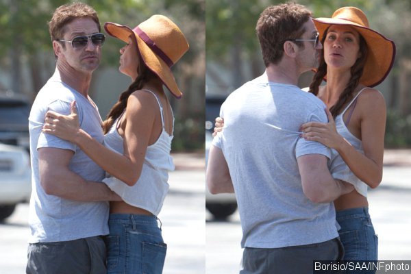 Gerard Butler Caught Red-Handed With His Hands Up Girlfriend Morgan Brown's Top