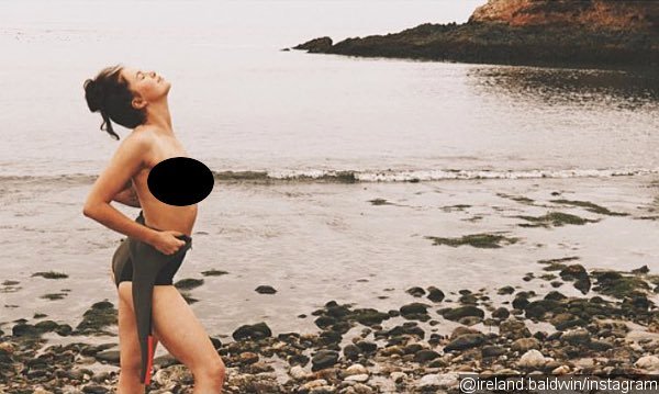 Ireland Baldwin Shares a Photo of Herself Topless by the Beach