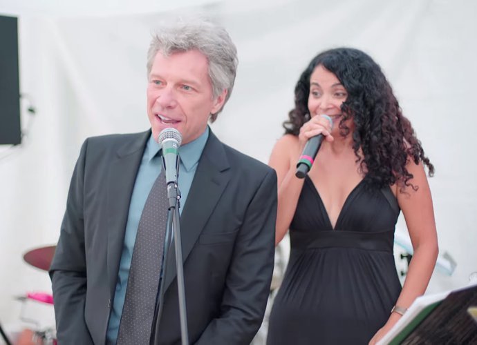 Watch Jon Bon Jovi Reluctantly Join Wedding Band for 'Livin' on a Prayer'