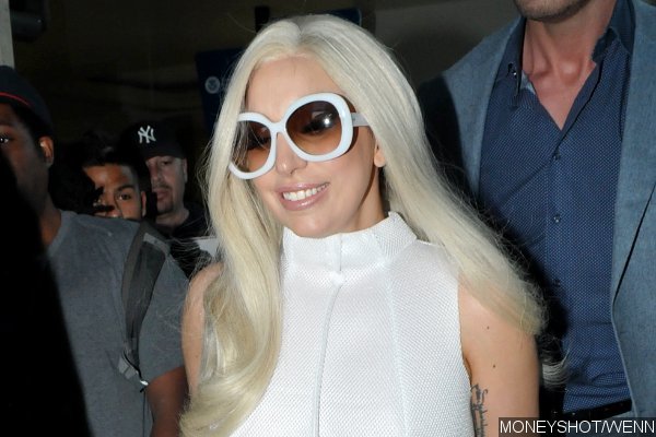 Lady GaGa Hides Her Engagement Ring as She Strolls Through LAX