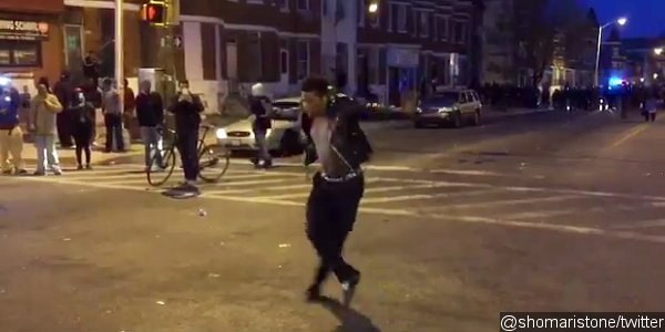 Video: Man Dances to Michael Jackson's 'Beat It' During Baltimore Riots