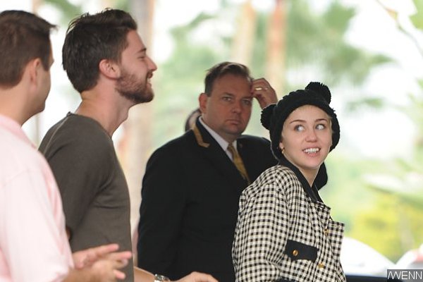 Miley Cyrus Reacts to Patrick Schwarzenegger Cheating Rumors With Bizarre Pic