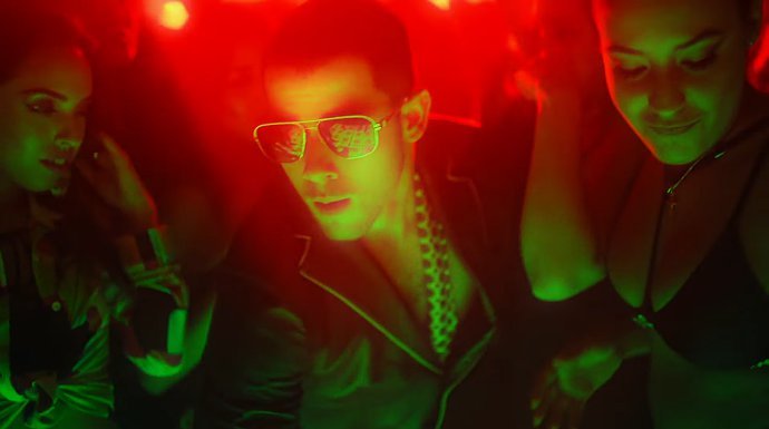 Nick Jonas Surrounded by Sexy Ladies in 'Champagne Problems' Music Video