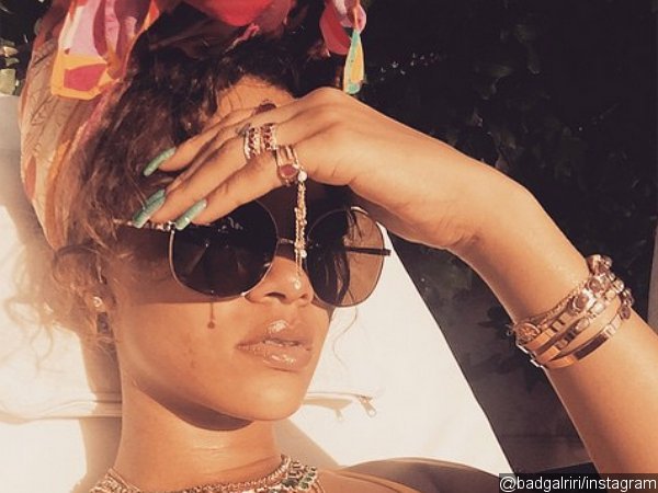 Rihanna Wears Tiny Yellow Bikini and Flashy Jewelry While Sunbathing in Barbados
