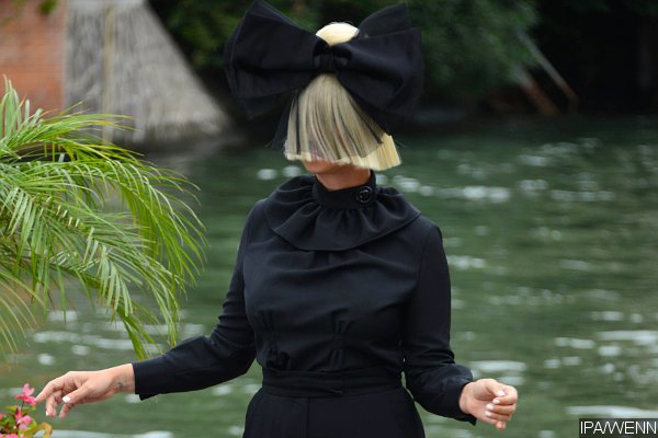 Sia Conceals Her Face With Trademark Blonde Wig and Huge Bow at Venice Film Festival