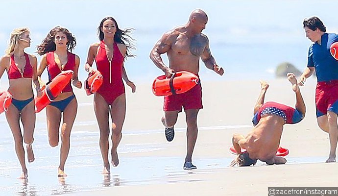 Oops! Zac Efron Takes a Big Tumble in New 'Baywatch' Pic and Pokes Fun at It