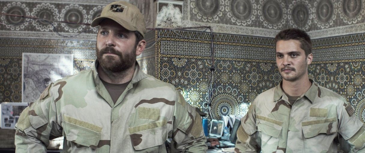 Bradley Cooper stars as Chris Kyle and Luke Grimes stars as Marc Lee in Warner Bros. Pictures' American Sniper (2014)