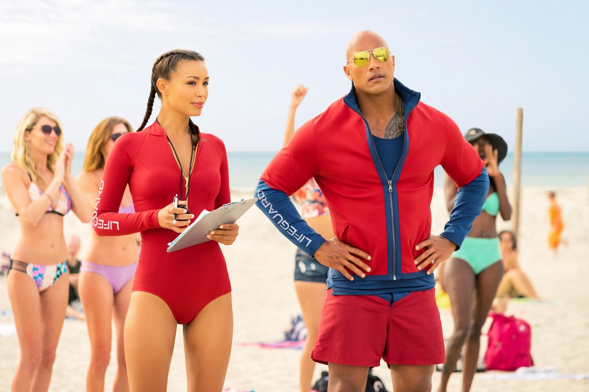 Ilfenesh Hadera stars as Stephanie Holden and The Rock stars as Mitch Buchannon in Paramount Pictures' Baywatch (2017)
