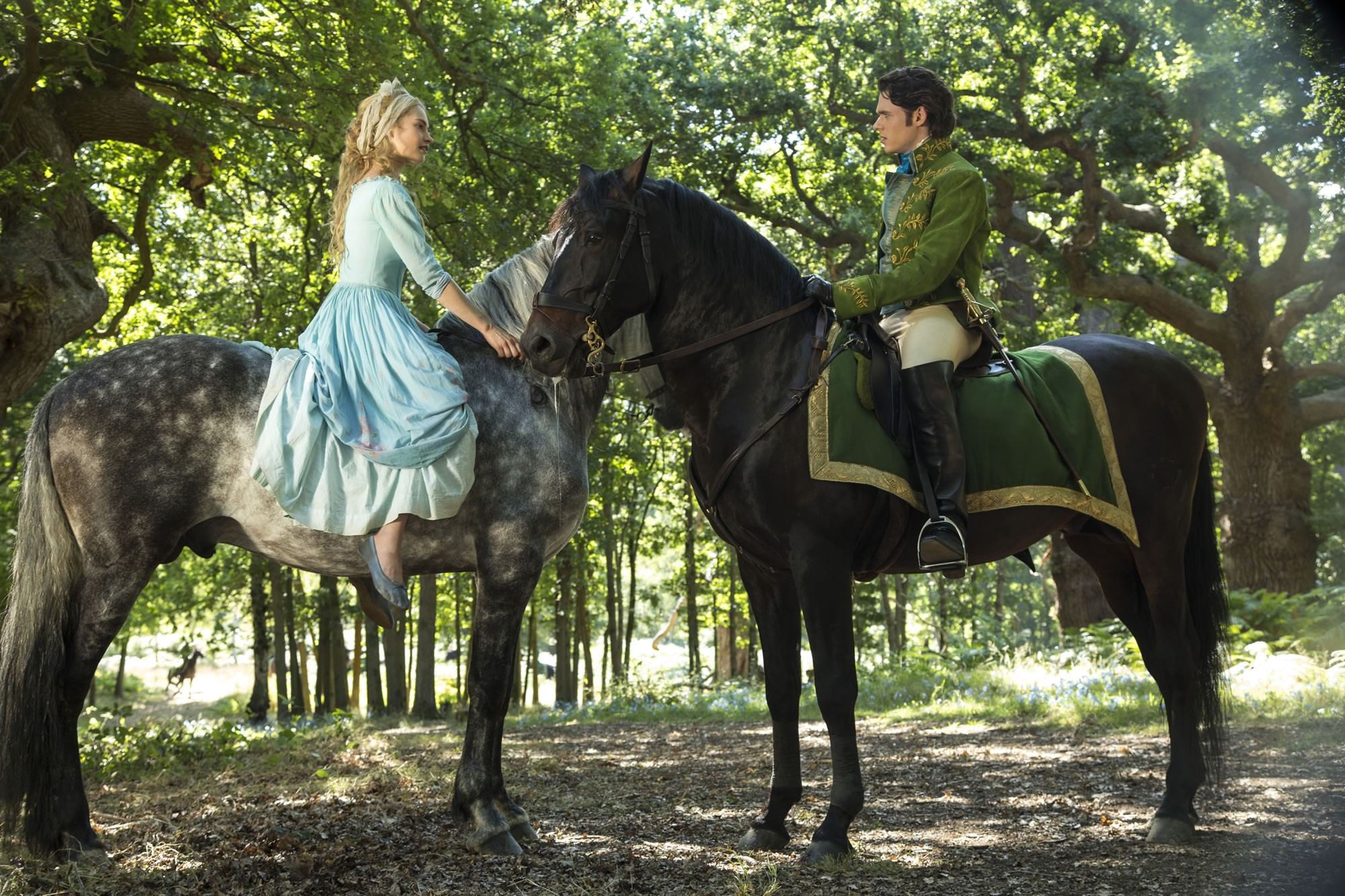 Lily James stars as Cinderella and Richard Madden stars as Prince Charming in Walt Disney Pictures' Cinderella (2015). Photo credit by Jonathan Olley.