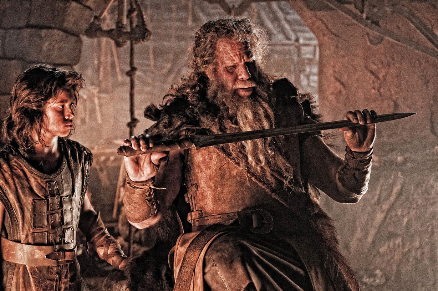 Leo Howard stars as Young Conan and Ron Perlman stars as Corin in Lionsgate Films' Conan the Barbarian (2011)
