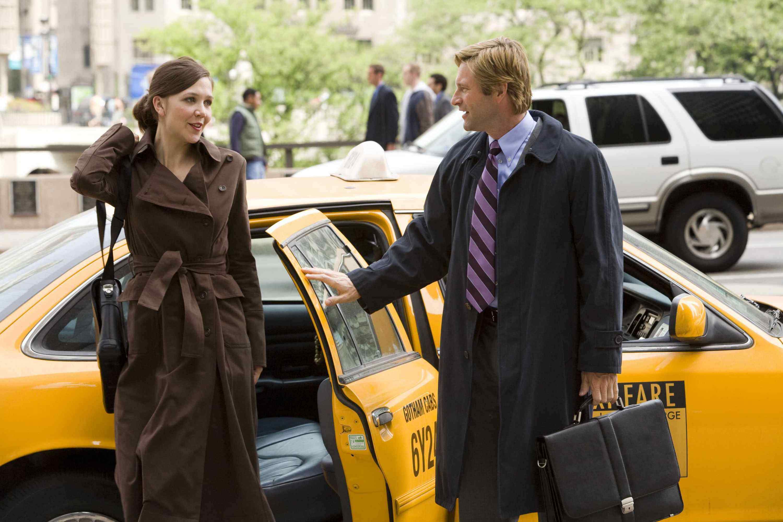 MAGGIE GYLLENHAAL stars as Rachel Dawes and AARON ECKHART stars as Harvey Dent in Warner Bros. Pictures' and Legendary Pictures' action drama 