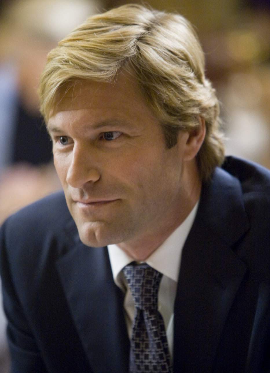 AARON ECKHART stars as Harvey Dent in Warner Bros. Pictures' and Legendary Pictures' action drama 