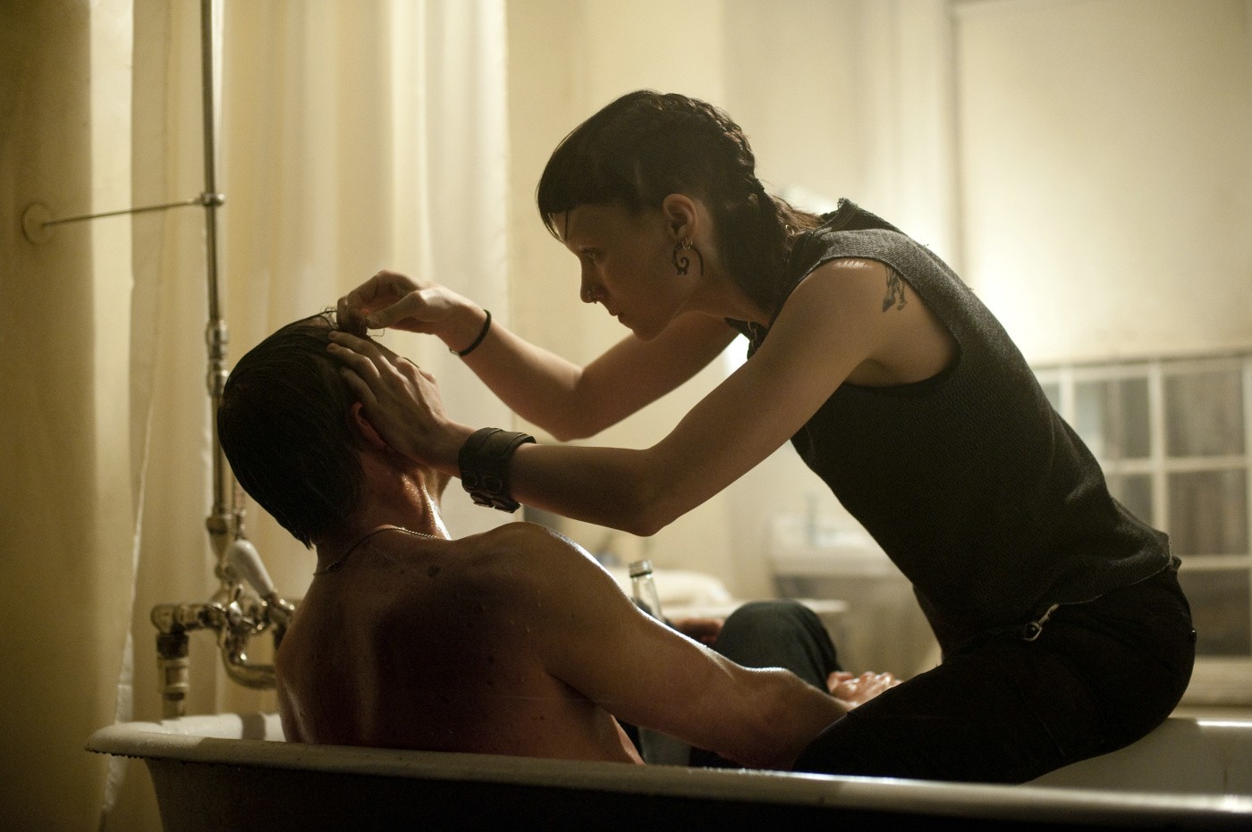 Rooney Mara stars as Lisbeth Salander and Daniel Craig stars as Mikael Blomkvist in Columbia Pictures' The Girl with the Dragon Tattoo (2011)