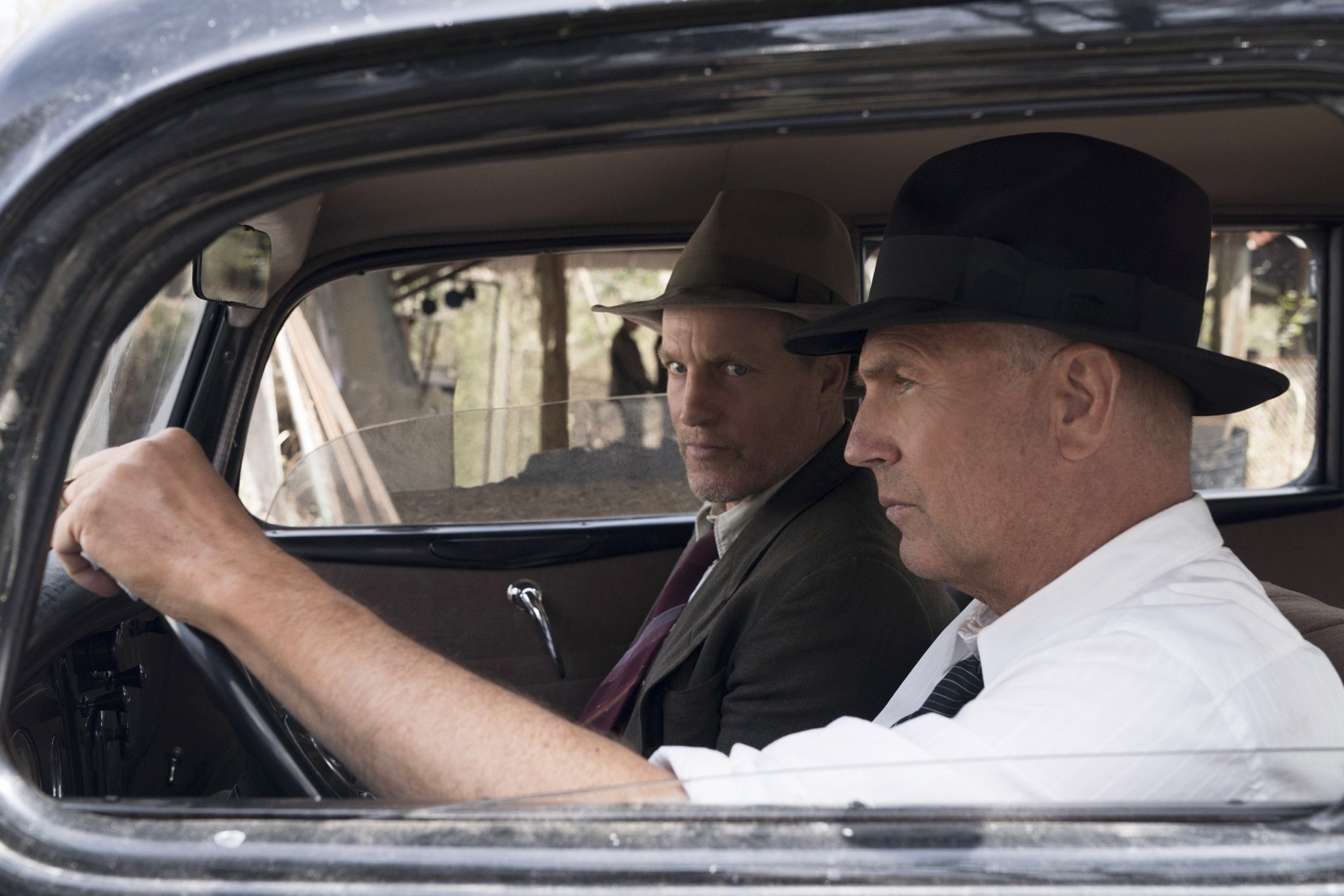 Woody Harrelson stars as Maney Gault and Kevin Costner stars as Frank Hamer in Netflix's The Highwaymen (2019)