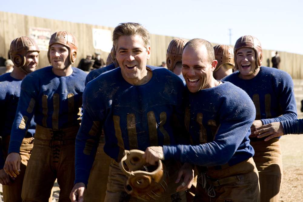 Zoom (NICK PAONESSA), Bulldogs team captain Dodge Connolly (GEORGE CLOONEY) and Curly (MATT BUSHELL) in Universal Pictures' Leatherheads (2008).